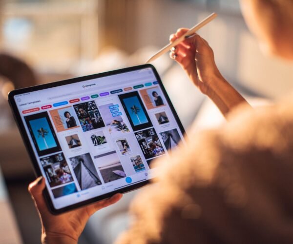 woman holding tablet computer