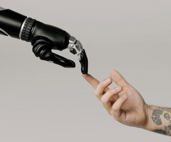 bionic hand and human hand finger pointing