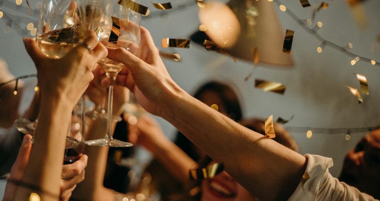 people toasting wine glasses